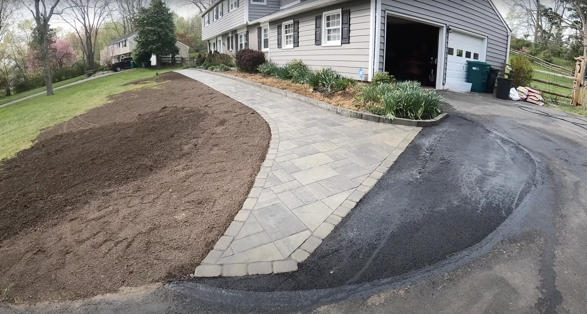 Custom stamped concrete driveway and walkway by Haltom City Concrete - Decorative paver pattern design Elegant stamped concrete walkway and driveway installation with decorative paver patterns