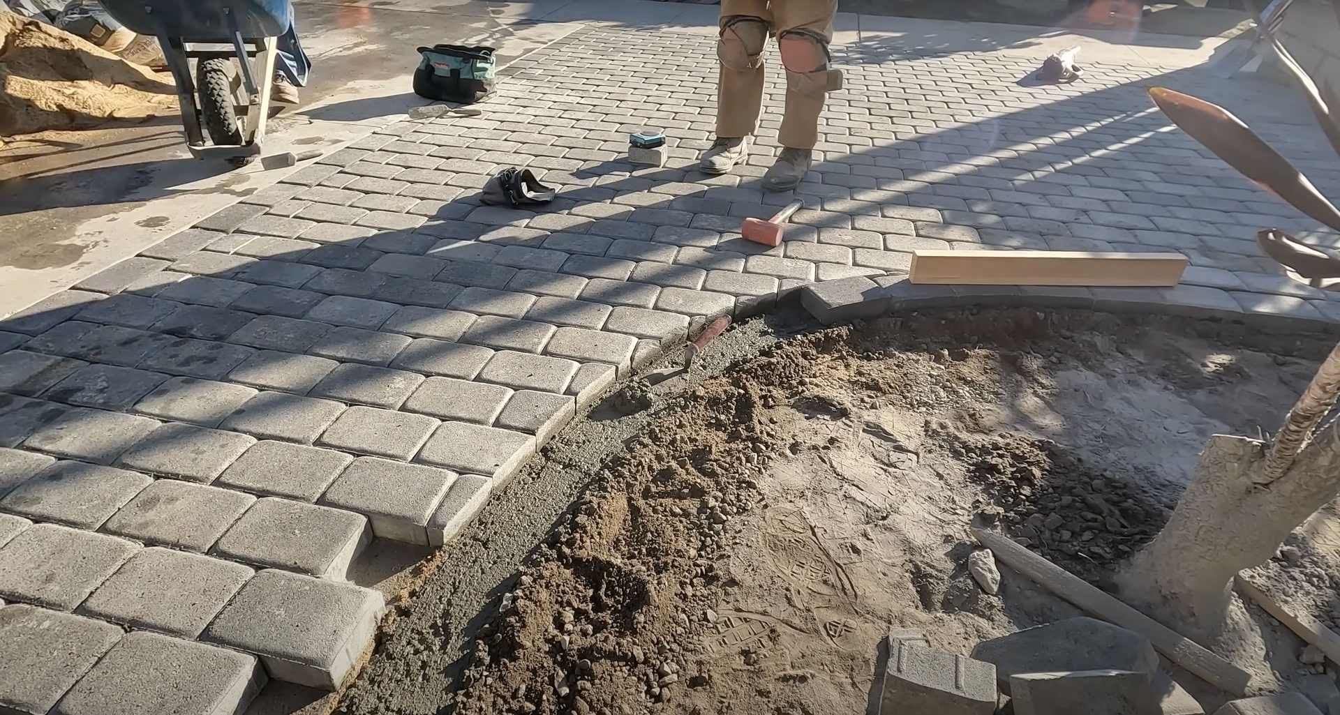 Expert concrete paving services by Haltom City Concrete - Professional installation process Professional concrete paving installation with workers using specialized equipment